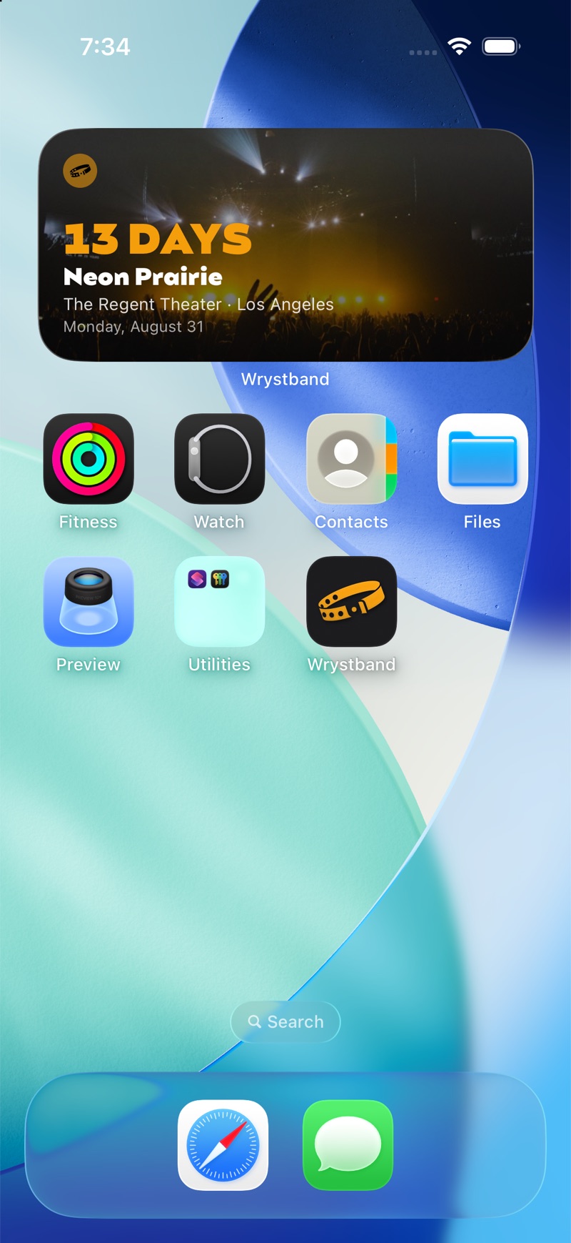 iPhone Home Screen with the Wrystband widget over a tinted crowd photo: 13 days until Neon Prairie at The Regent Theater